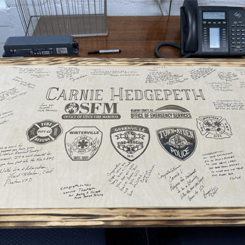 Carnie's gift with signatures and notes written on it